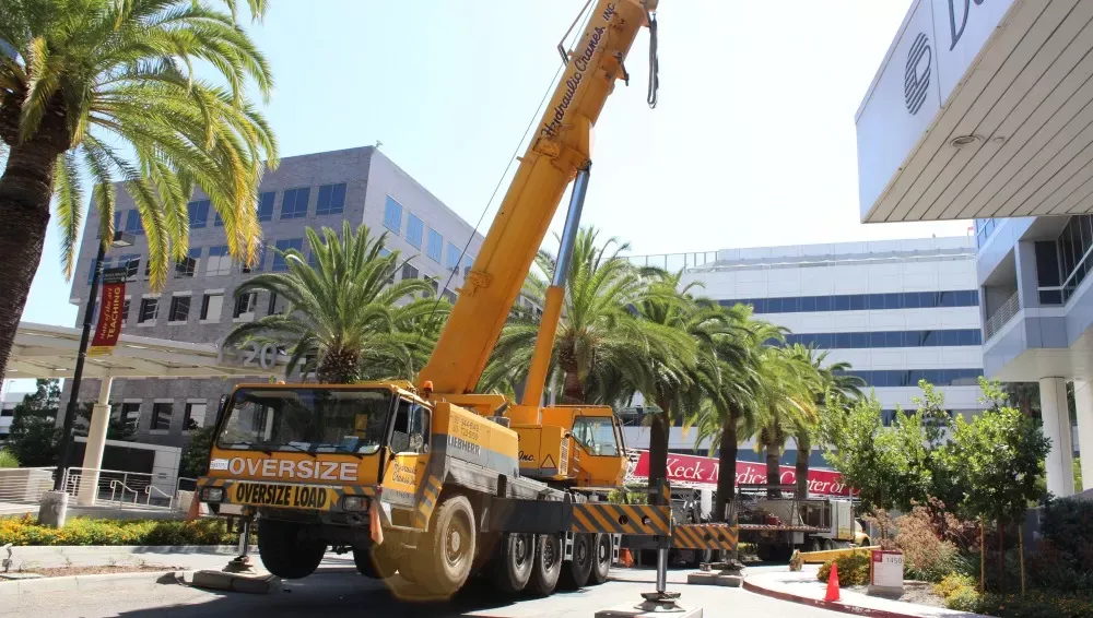 Crane and crew working on site