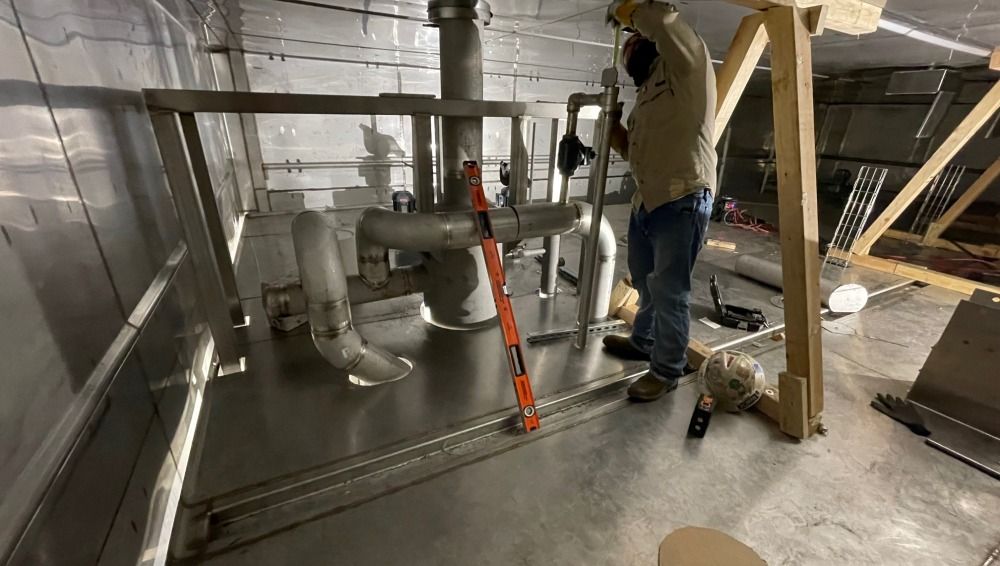 Worker installing AC unit