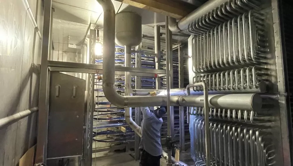 Workers installing ac unit