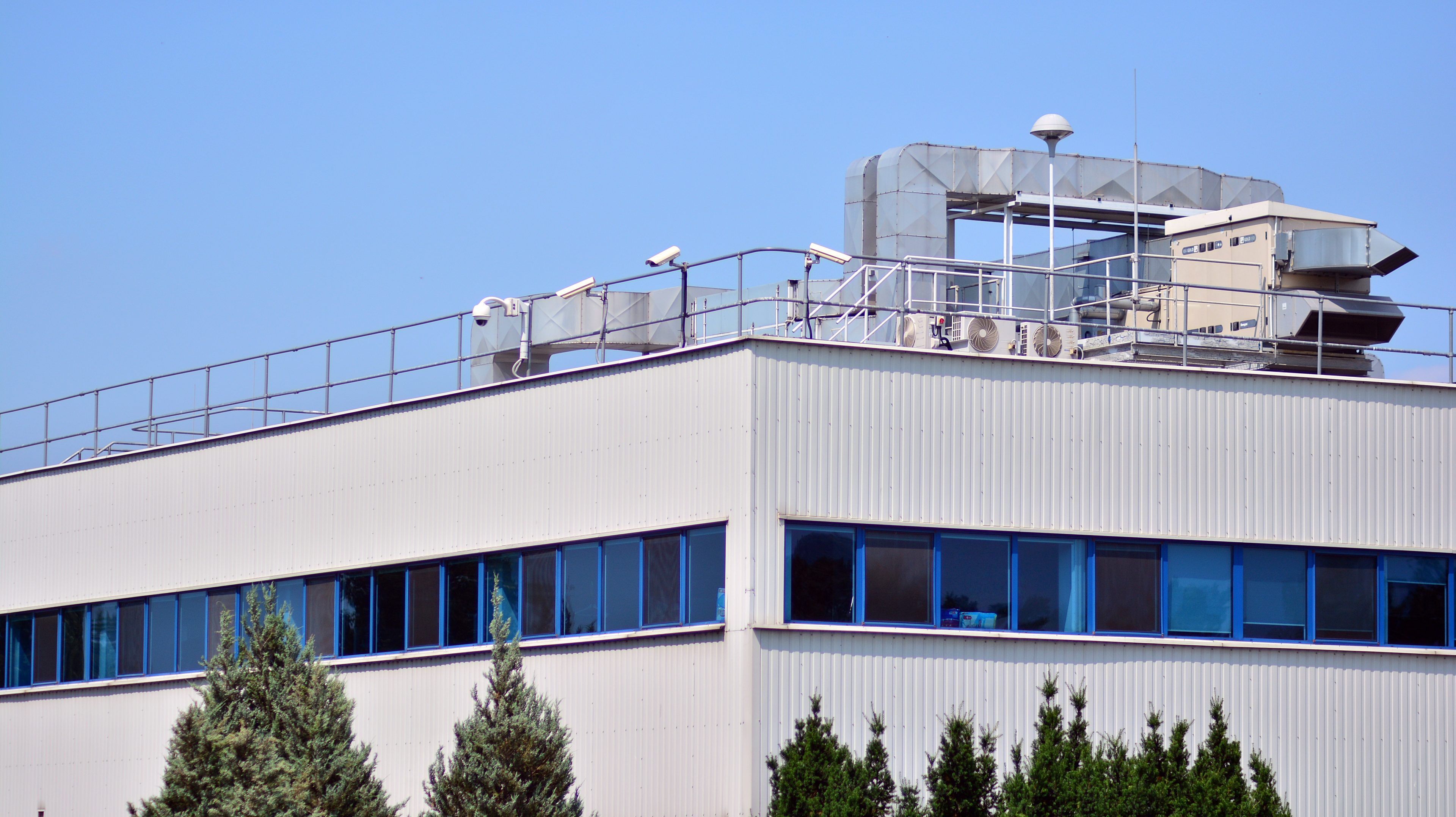 building-with-lot-windows-sign-that-says-air-conditioning