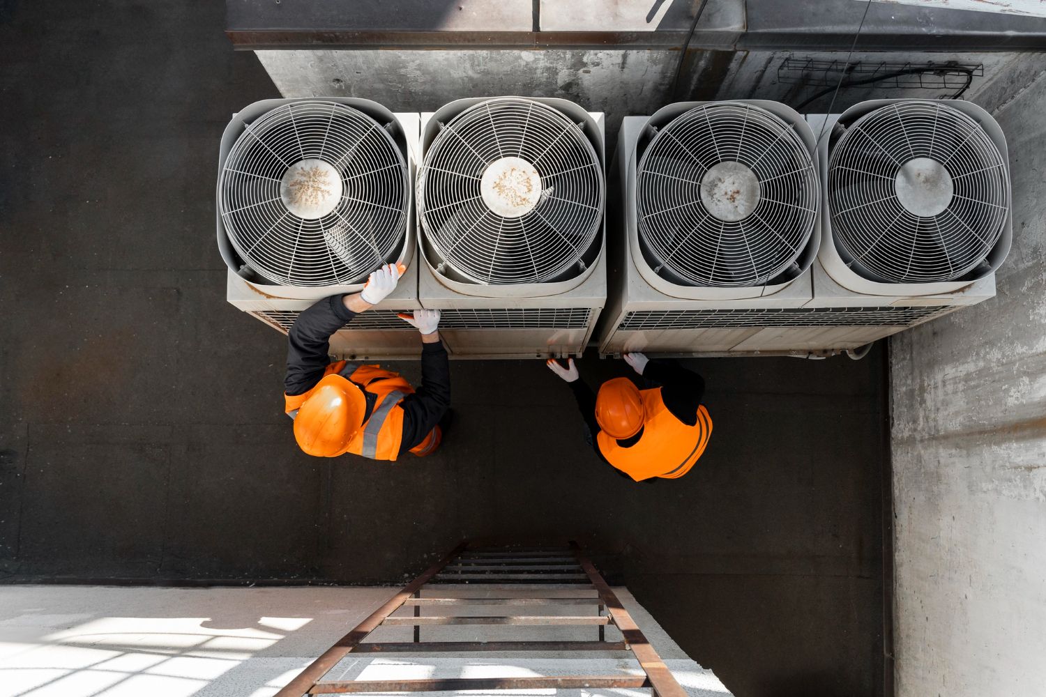 Workers checking AC systems