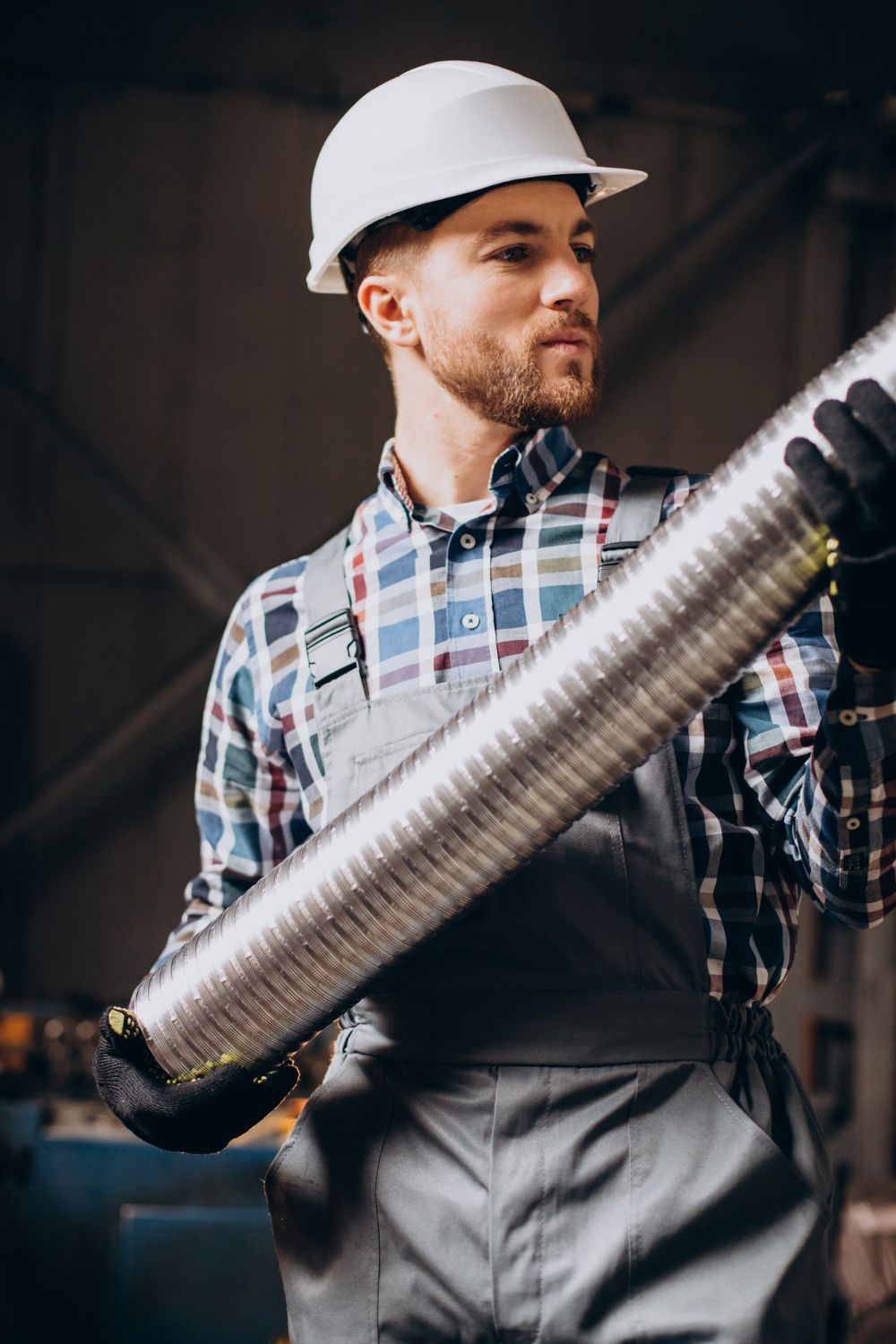 Worker installing pipes